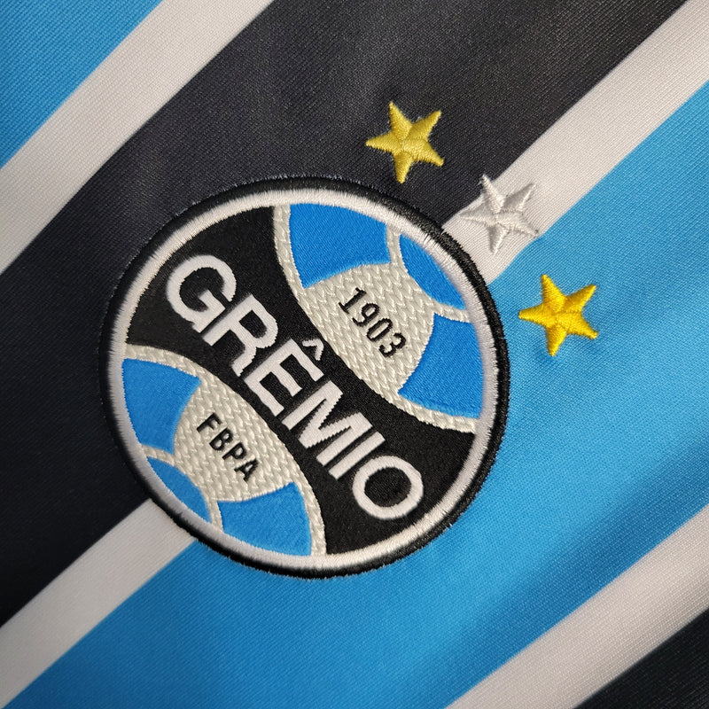 Camisa Grêmio Home 23/24 Torcedor Umbro Feminina - Azul, Preto e Branco