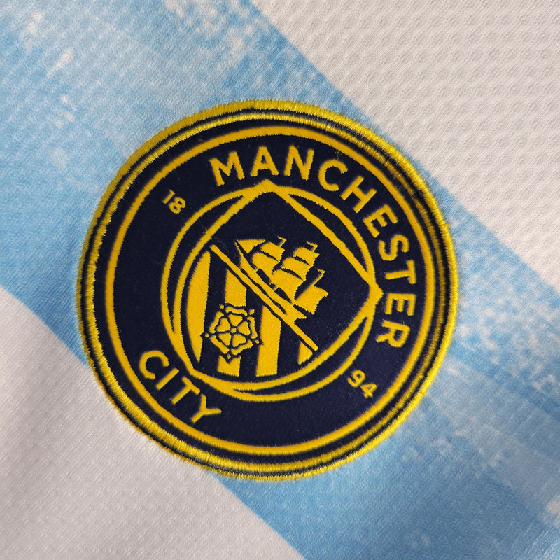 Camisa Manchester City Edição Comemorativa 22/23 Torcedor Puma Masculina - Branca e Azul